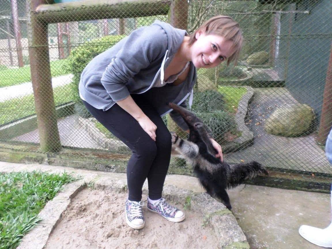 Sophie volunteering at Criadouro Onça Pintada in Paraná, Brazil, November 2015 — bottle-feeding a jaguar, caring for anteaters, toucans, pumas and ocelots, and planting a tree on the reserve